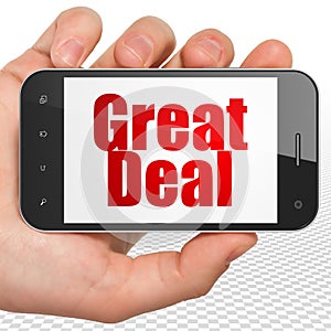 Business concept: Hand Holding Smartphone with Great Deal on display