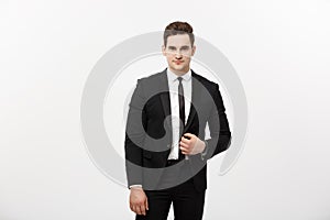 Business Concept: Handsome Man Happy Smile Young Handsome Guy in smart suit posing over Grey Background.