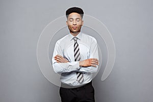 Business Concept - Happy professional african american businessman confident arms crossed