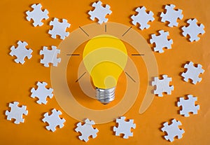 Business concept,idea,innovation,recruitment,human resources,start up.Light bulb and jigsaw puzzle pieces