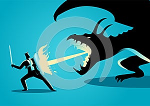 Businessman fighting a dragon photo