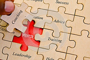 Business concept image of Jigsaw puzzle pieces with word Mentoring