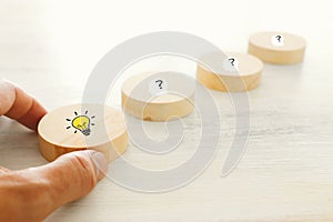 Business Concept image of revealing an idea, finding the right solution during creative process. Hand picking round cube with