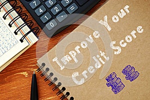 Business concept about Improve Your Credit Score with inscription on the sheet photo