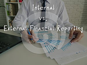 Business concept about Internal vs. External Financial Reporting with inscription on the piece of paper