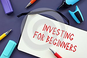 Business concept about Investing for Beginners with sign on the piece of paper
