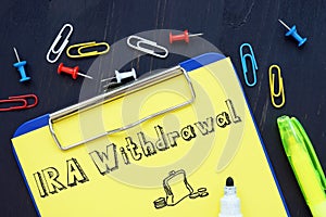 Business concept about IRA Withdrawal with sign on the sheet photo