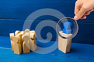 Business concept of leader and leadership qualities, crowd management, political debate and elections. Magnifying glass is looking