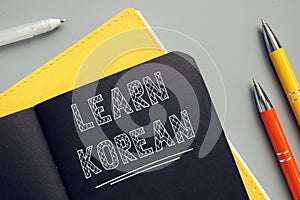 Business concept about LEARN KOREAN with sign on the sheet photo
