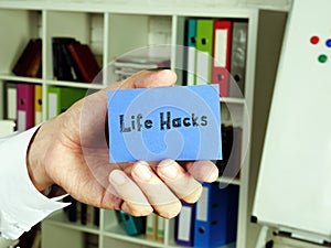 Business concept about Life Hacks  with phrase on the piece of paper