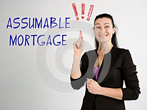Business concept meaning ASSUMABLE MORTGAGE exclamation marks with phrase on the wall