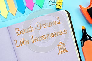 Business concept meaning Bank-Owned Life Insurance BOLI with sign on the piece of paper