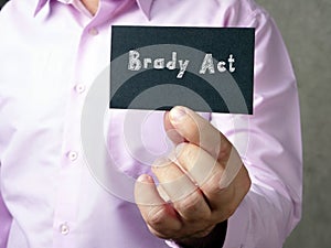 Business concept meaning Brady Act  with sign on the page