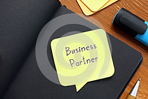 Business concept meaning Business Partner with sign on the page