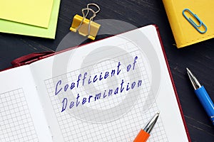 Business concept meaning Coefficient of Determination with sign on the piece of paper