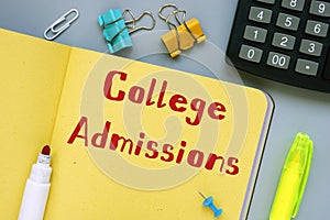 Business concept meaning College Admissions with inscription on the sheet