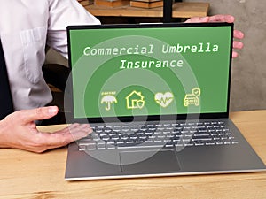 Business concept meaning Commercial Umbrella Insurance with phrase on the page