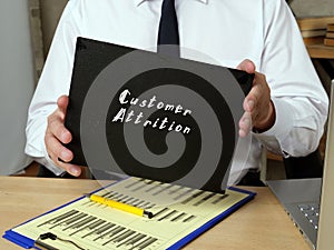 Business concept meaning Customer Attrition with sign on the sheet