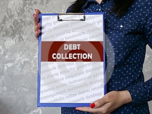 Business concept meaning DEBT COLLECTION with inscription on the sheet