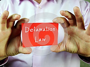 Business concept meaning Defamation Law with phrase on the piece of paper