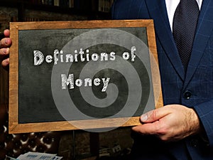 Business concept meaning Definitions of Money with sign on the black chalkboard