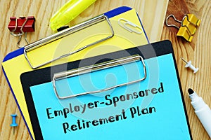 Business concept meaning Employer-Sponsored Retirement Plan with sign on the sheet photo