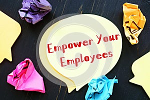 Business concept meaning Empower Your Employees with phrase on the sheet