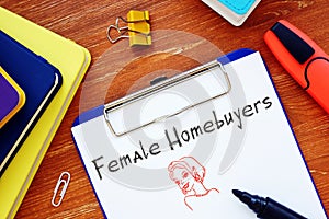 Business concept meaning Female Homebuyers with sign on the page photo