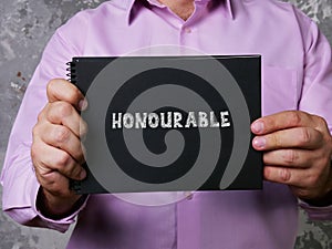 Business concept meaning HONOURABLE with sign on the page photo