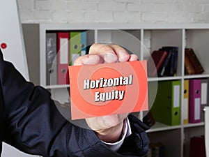 Business concept meaning Horizontal Equity with inscription on the piece of paper