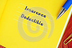 Business concept meaning Insurance Deductible with phrase on the page