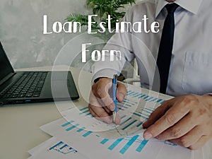 Business concept meaning Loan Estimate Form with phrase on the piece of paper