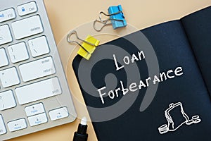 Business concept meaning Loan In Forbearance with sign on the page