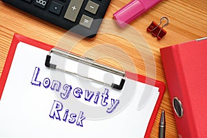 Business concept meaning Longevity Risk with sign on the page