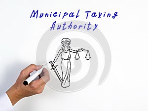 Business concept meaning Municipal Taxing Authority with inscription on the piece of paper