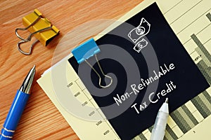 Business concept meaning Non-Refundable Tax Credit with phrase on the sheet