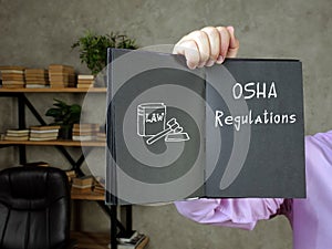 Business concept meaning OSHA Regulations with sign on the sheet