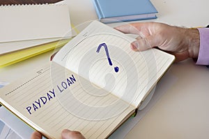 Business concept meaning PAYDAY LOAN with sign on the computer