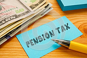 Business concept meaning PENSION TAX with sign on the sheet
