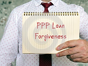 Business concept meaning PPP Loan Forgiveness with sign on the piece of paper