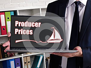 Business concept meaning Producer Prices with sign on laptop