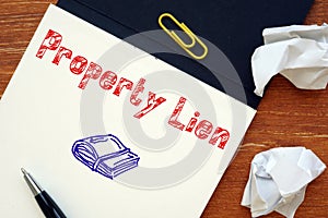 Business concept meaning Property Lien with phrase on the piece of paper photo