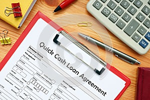 Business concept meaning Quick Cash Loan Agreement with phrase on the financial document