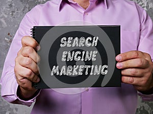 Business concept meaning SEARCH ENGINE MARKETING with phrase on the sheet