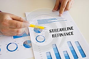 Business concept meaning STREAMLINE REFINANCE with sign on the chart sheet