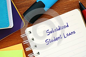 Business concept meaning Subsidized Student Loans with inscription on the page