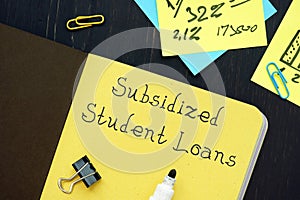 Business concept meaning Subsidized Student Loans with phrase on the page