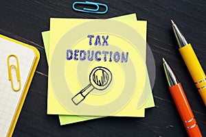 Business concept meaning TAX DEDUCTION with phrase on the sheet