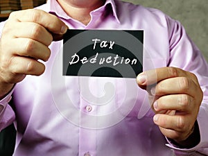 Business concept meaning Tax Deduction with sign on the page