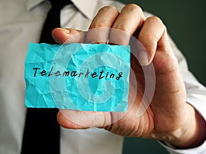 Business concept meaning Telemarketing with phrase on the piece of paper